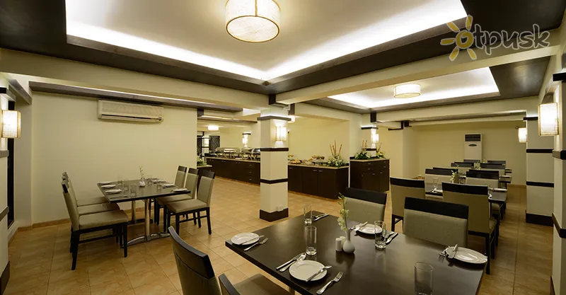 Фото отеля Deltin Suites 4* Šiaurės Goa Indija barai ir restoranai
