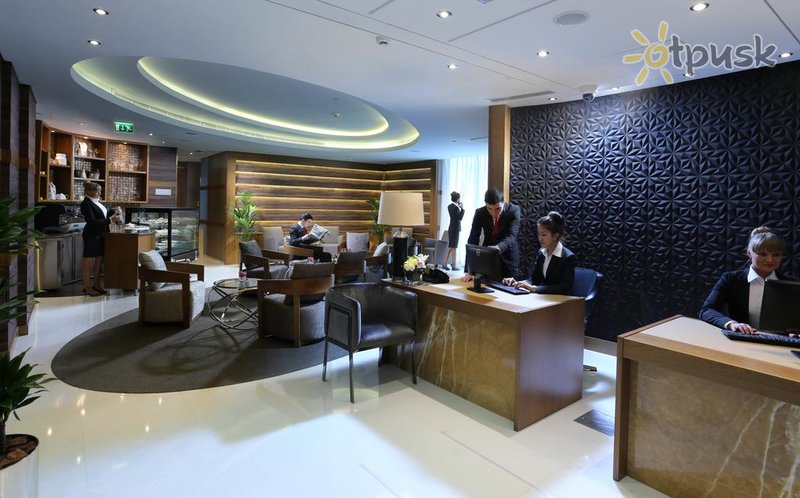 Фото отеля Tryp by Wyndham Abu Dhabi 4* Абу Даби ОАЭ лобби и интерьер