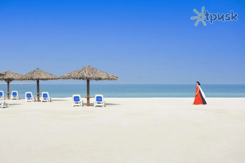 Фото отеля Hilton Al Hamra Beach & Golf Resort 5* Рас Аль-Хайма ОАЕ пляж