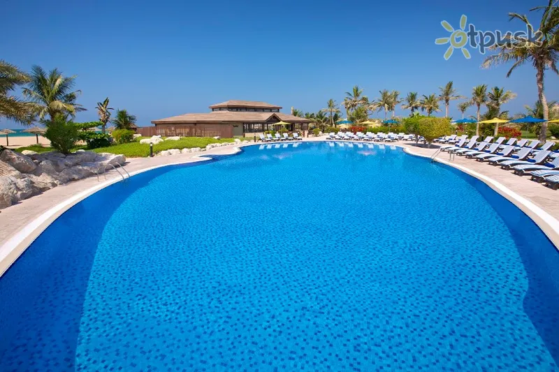 Фото отеля Hilton Al Hamra Beach & Golf Resort 5* Рас Аль-Хайма ОАЭ экстерьер и бассейны