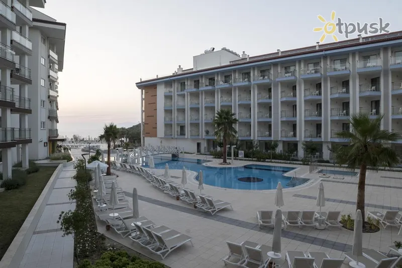 Фото отеля Ramada Hotel & Suites Kusadasi 5* Кушадасы Турция экстерьер и бассейны