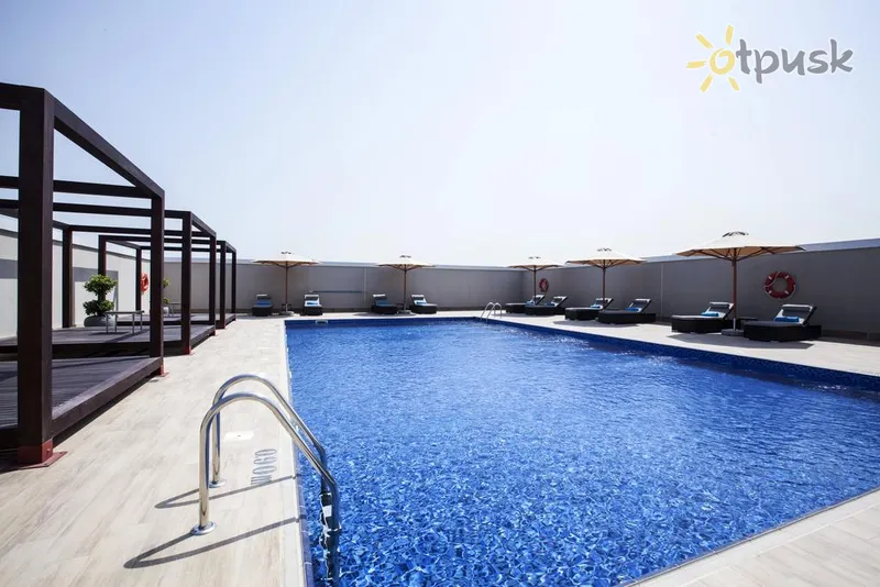 Фото отеля Flora Inn Hotel Dubai Airport 4* Дубай ОАЭ экстерьер и бассейны