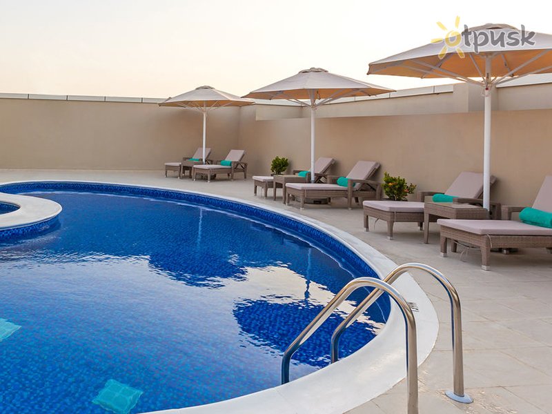 Фото отеля Flora Al Barsha Hotel 4* Дубай ОАЭ экстерьер и бассейны