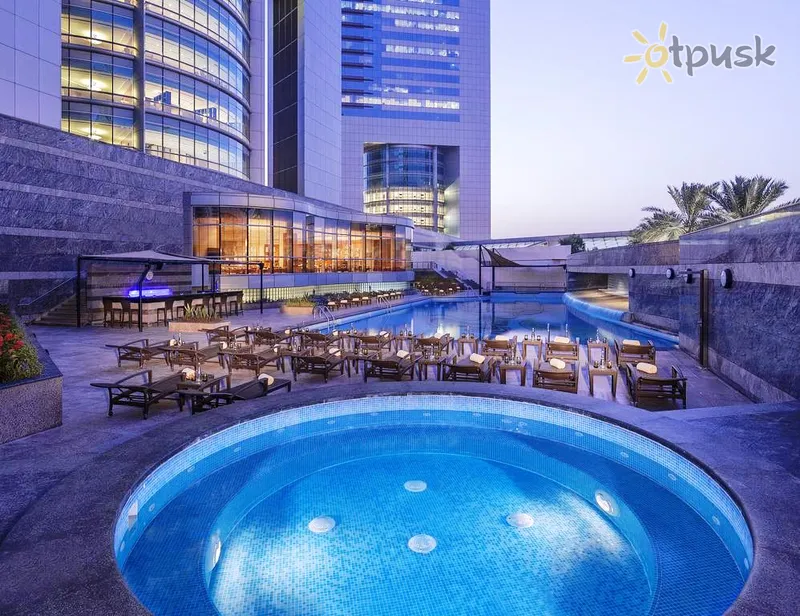 Фото отеля Jumeirah Emirates Towers 5* Дубай ОАЭ экстерьер и бассейны