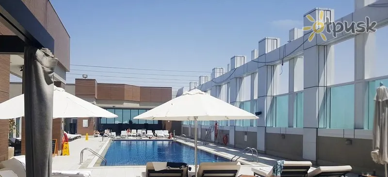 Фото отеля Sheraton Grand Hotel 5* Dubajus JAE išorė ir baseinai