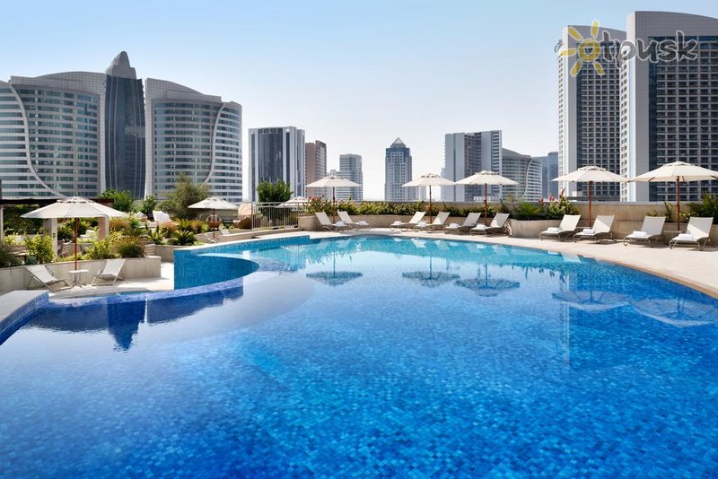 Фото отеля Movenpick Hotel Apartments Downtown Dubai 5* Дубай ОАЭ экстерьер и бассейны
