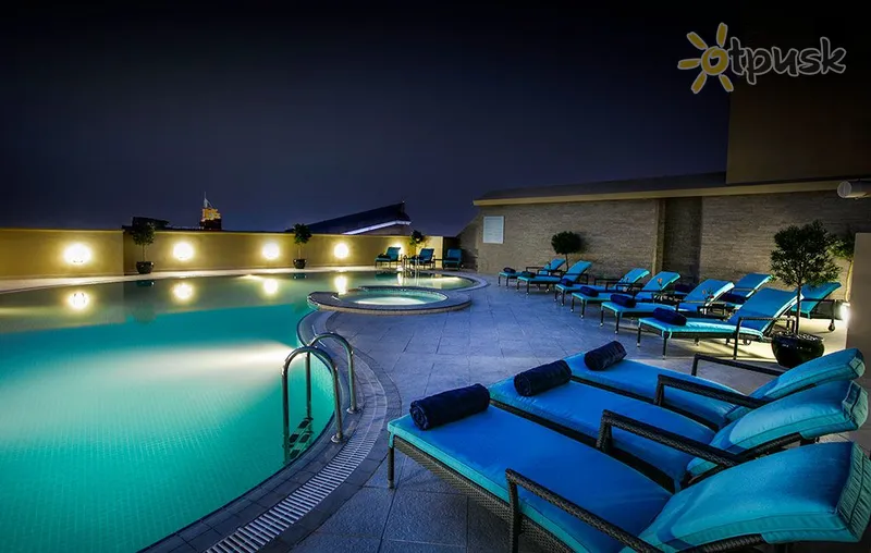 Фото отеля Elite Byblos Hotel 5* Дубай ОАЭ экстерьер и бассейны