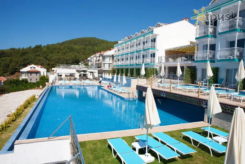 Фото отеля Ramada by Wyndham Fethiye Oludeniz 4* Фетхіє Туреччина екстер'єр та басейни