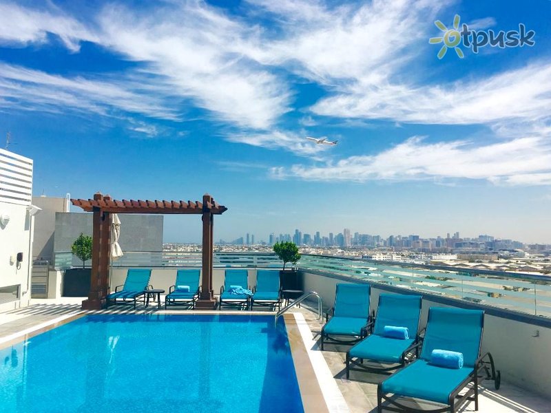 Фото отеля Hilton Garden Inn Dubai Al Muraqabat 4* Дубай ОАЭ экстерьер и бассейны