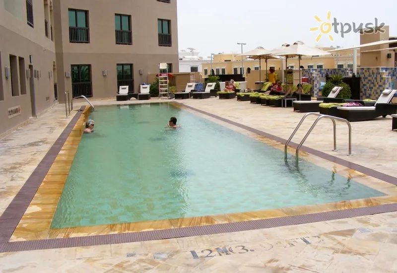 Фото отеля Traders Hotel Qaryat Al Beri Abu Dhabi 4* Абу Даби ОАЭ экстерьер и бассейны