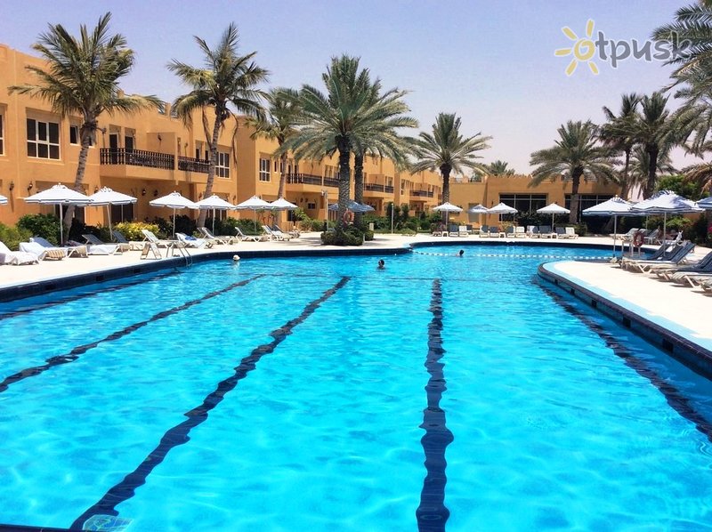 Фото отеля Al Hamra Village Golf & Beach Resort 4* Рас Аль-Хайма ОАЭ экстерьер и бассейны
