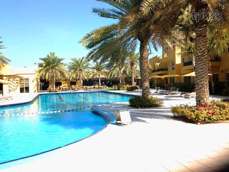 Фото отеля Al Hamra Village Golf & Beach Resort 4* Рас Аль-Хайма ОАЭ экстерьер и бассейны