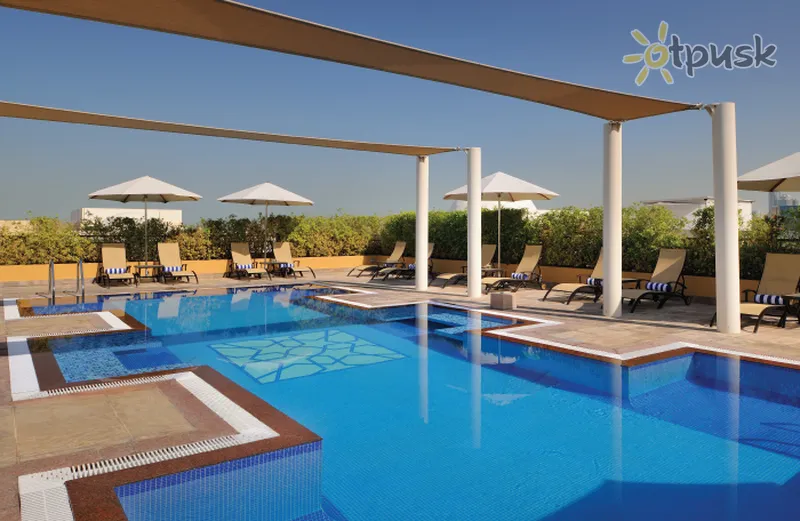 Фото отеля Movenpick Hotel Apartments Al Mamzar Dubai 5* Дубай ОАЭ экстерьер и бассейны