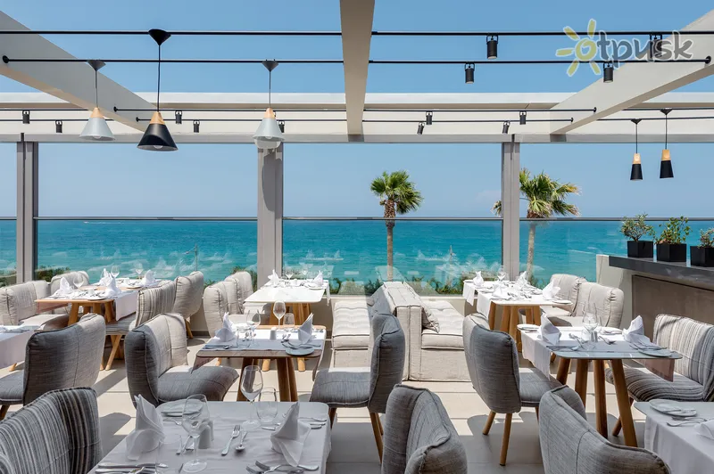 Фото отеля Ikones Seafront Luxury Suites 5* par. Krēta - Retimno Grieķija bāri un restorāni