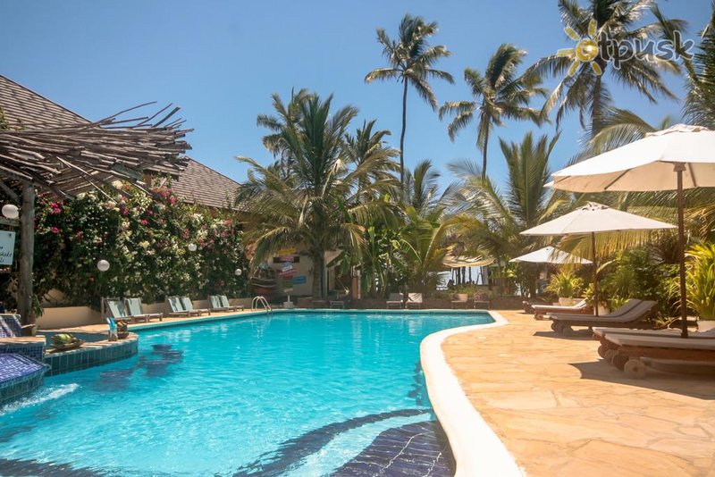 Фото отеля The Waterfront Zanzibar Beach Hotel 4* Паже Танзания экстерьер и бассейны