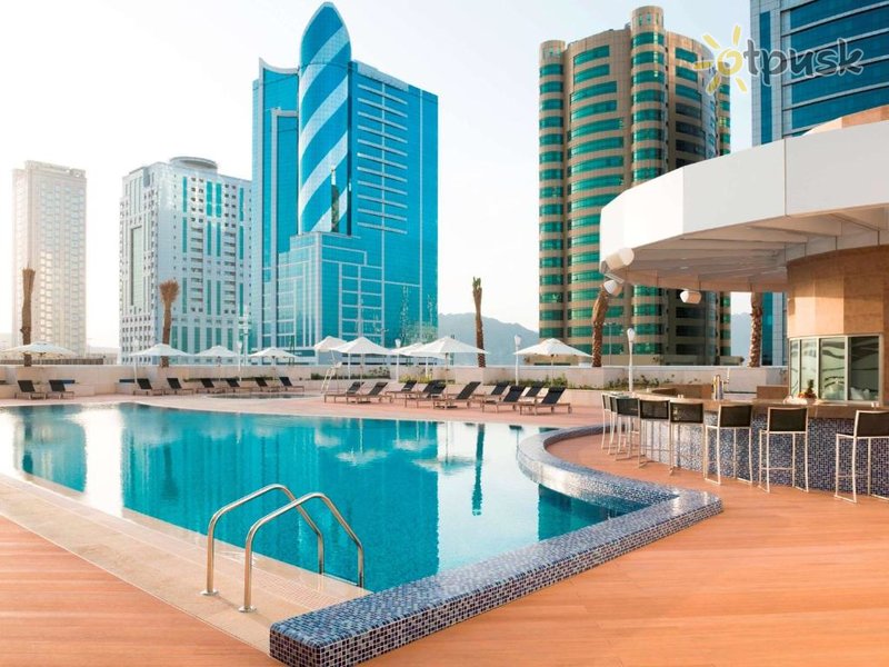 Фото отеля Adagio Fujairah Aparthotel 4* Фуджейра ОАЭ экстерьер и бассейны