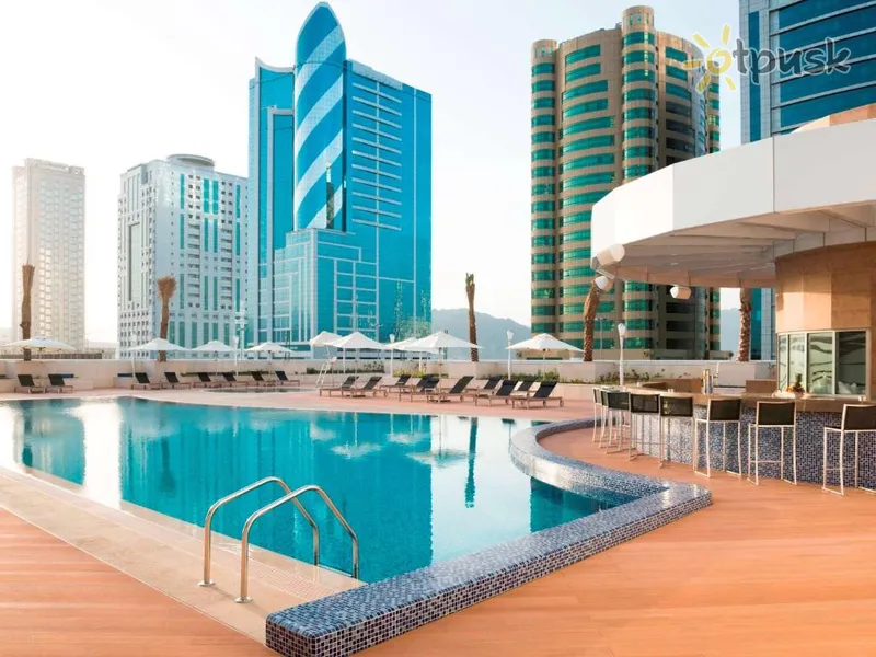Фото отеля Adagio Fujairah Aparthotel 4* Fujairah JAE išorė ir baseinai