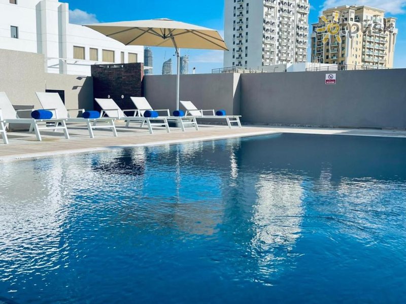Фото отеля Grand Kingsgate Waterfront By Millennium Hotel 4* Дубай ОАЭ экстерьер и бассейны