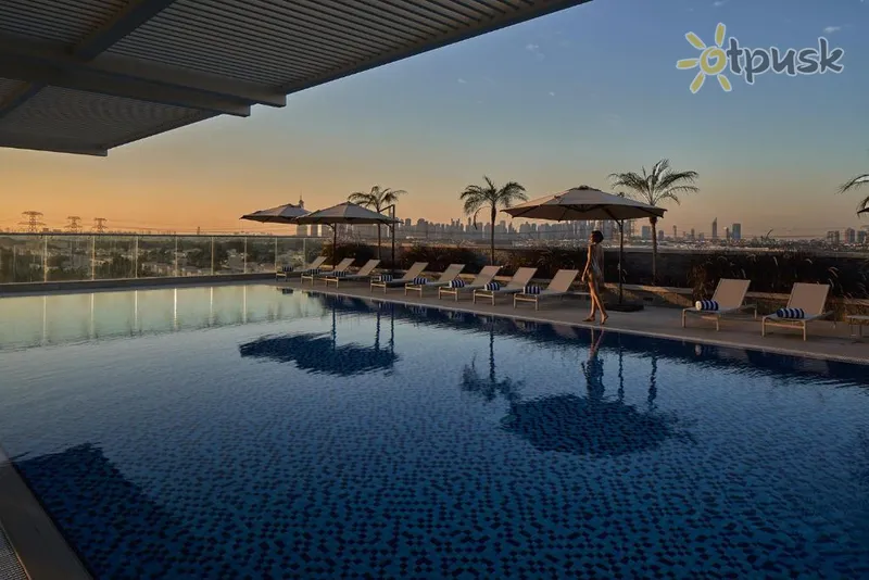 Фото отеля Movenpick Jumeirah Village Triangle 5* Дубай ОАЭ экстерьер и бассейны