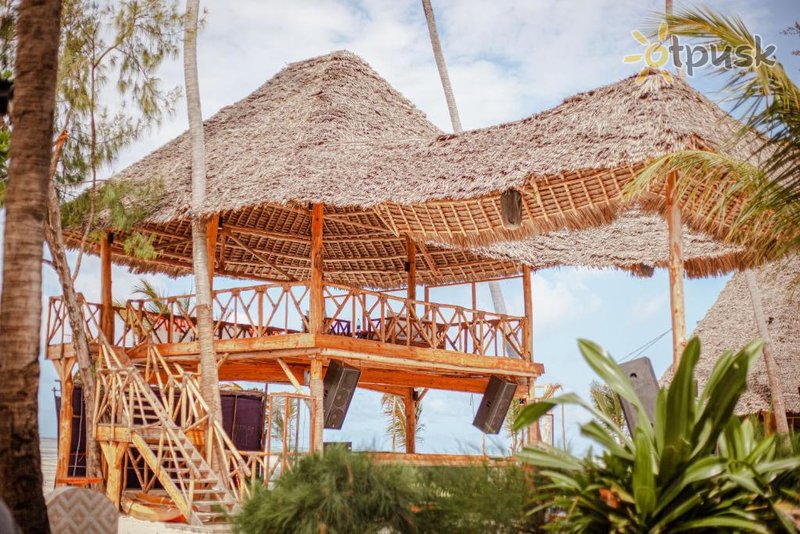 Фото отеля Tiki Beach Club & Resort 4* Паже Танзания экстерьер и бассейны