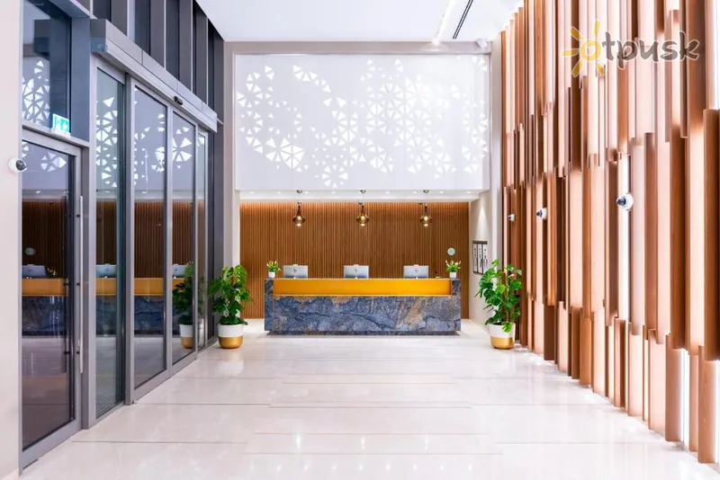Фото отеля Tumbi West Palm Beach Hotel Dubai, Tapestry Collection Hilton 4* Дубай ОАЭ экстерьер и бассейны